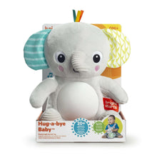 Gray plush elephant baby soother with light-up belly and crinkle side wings, in box