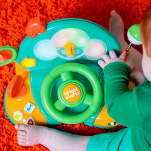 Bright Starts driver learning toy, teal dome with green light wheel and orange side buttons