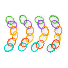 Close-up of interlocking colorful loop link rings in green, purple, orange, yellow, and teal