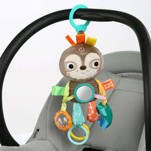 Sloth take-along activity toy clipped to stroller seat with hanging sensory links