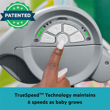 Baby swing speed control dial with finger pointing to a button