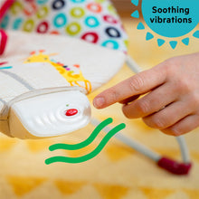 Vibrating infant bouncer control button on white base with patterned seat