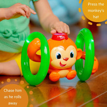 Monkey roll-and-glow baby toy with orange monkey face and green light-up rings