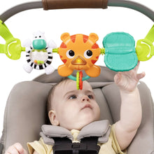 Baby activity toy bar in stroller with orange fox, teal book, white rattle and green clips