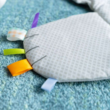 Polar bear activity mat with textured fabric and colorful sensory ribbons