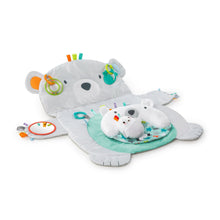 Polar bear baby activity mat with green ring toy and plush polar bear