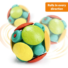 Rolling wobble ball toy with green shell, teal flippers, and orange base