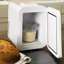 White sourdough proofing device with open door and glass jar inside