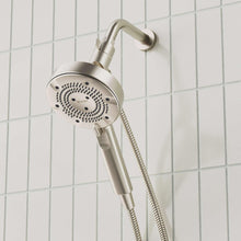 Handheld shower head with hose, round spray face and control dial