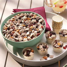 Chocolate snack pieces in a bowl with small cone containers