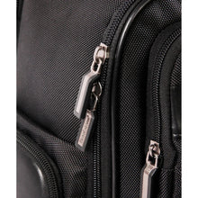 Black laptop backpack close-up of metal zipper pulls and woven fabric