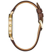 Three-hand leather watch with brown strap and gold-tone case, side view