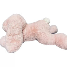 Light pink bunny plush lying on its side with long ears and plush body