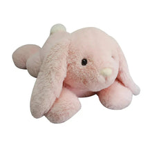 Light pink bunny plush with small nose and black stitched eyes, lying with ears forward