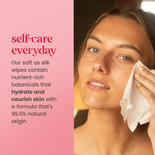 Woman gently wiping her face with a white cleansing wipe