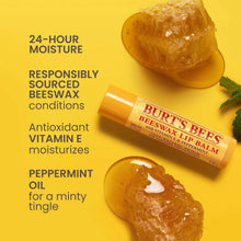 Lip balm tube with open cap showing yellow balm and a dish of balm-like mixture