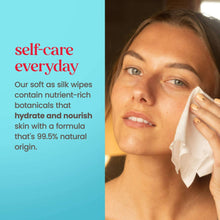 Woman wiping her cheek with a white micellar facial towelette in close-up