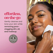 Woman using a white micellar facial towelette to cleanse and tone skin