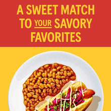 Baked beans plate with white bowl of beans and topped hot dog
