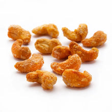 Butter toffee cashews with orange-gold coating