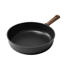 Carote titanium nonstick frying pan skillet, black with wood handle, tilted view