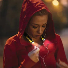 CAT LED neck light worn under a red hoodie with glowing front light modules