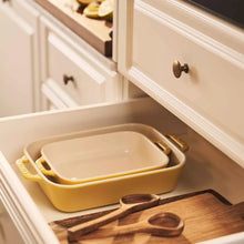 Yellow rectangular stoneware baker set with two nested trays and side handles