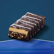 Oreo-style protein bar with chocolate coating and cookie crumbs, cross-section visible