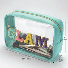 Teal clear-front cosmetic bag with glitter “GLAM” logo and open top