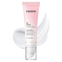 Tone-up cream tube with pink cap, shown with a white cream smear