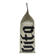 Cream whole bean coffee bag with black Vita logo and Seattle, WA 98122