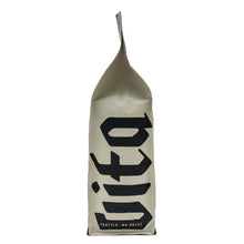 Whole bean coffee bag, beige, Caffe Vita logo and Seattle address