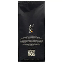 Ground coffee bag, dark black back panel with Caffe Vita info and barcode