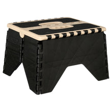 Plastic step stool with black textured sides, beige top rim, striped tread