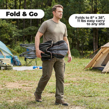 Portable folding camping chair in gray with attached carry bag, held by a person outdoors