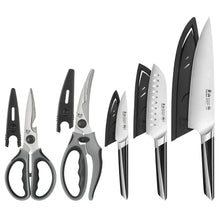Assorted knives and shears from the 5-piece set, silver blades with dark handles
