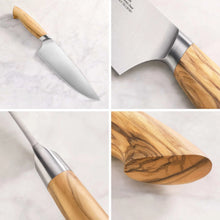 Stainless steel chef knife with light wooden handle, blade close-up