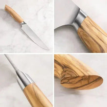 Stainless steel steak knife with light wood handle, blade edge visible