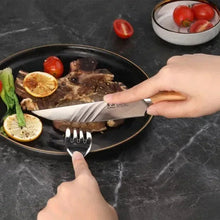Steak knife with light wood handle and stainless steel blade