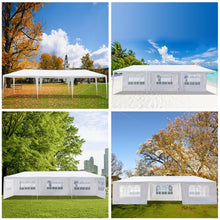 White pop-up canopy tent with multiple windowed side panels in outdoor views