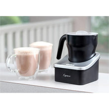 Capresso Automatic Milk Frother with black pitcher, clear lid, and frothing top