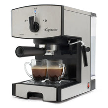 Espresso machine side view with black brew head, portafilter handle, two glass cups