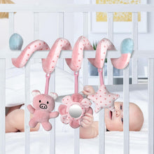 Pink piggy spiral plush toy with mirror ring and star rattle on crib bar