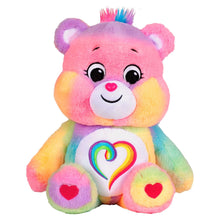 Togetherness Bear plush with tufted head, rainbow heart tummy, and heart paws.