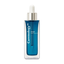 Blue night facial oil bottle with white dropper and clear glass