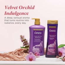 Two purple body wash bottles with gold pumps, with orchid flowers and lush bedding