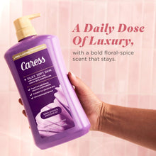 Purple body wash bottle with pump in hand; daily dose of luxury label text