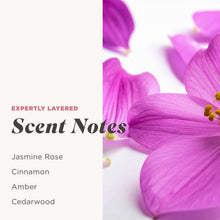 Purple orchid petals with scent notes listing Jasmine Rose, Cinnamon, Amber, and Cedarwood