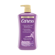 Purple body wash bottle with gold pump, front label reading body wash