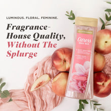 Caress Daily Silk moisturizing body soap bottle with gold cap, pink label.